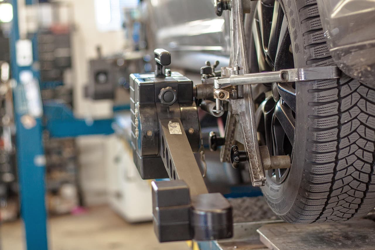 Wheel alignment clamps fitted to a car on the lift